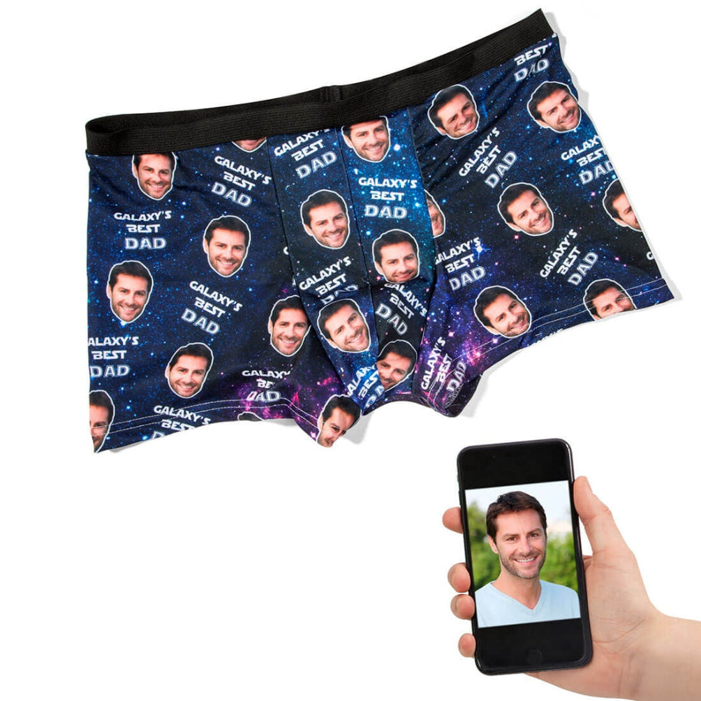 Personalized underwear with a pattern of a man's face and a hand holding a phone displaying the same face.