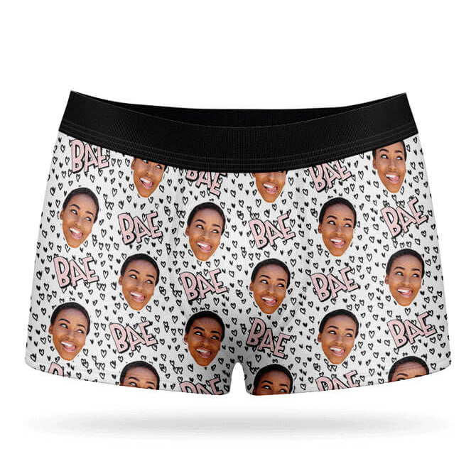 A pair of white boxer shorts with a custom print of a person's face and the text 'BAE' repeated across the fabric.