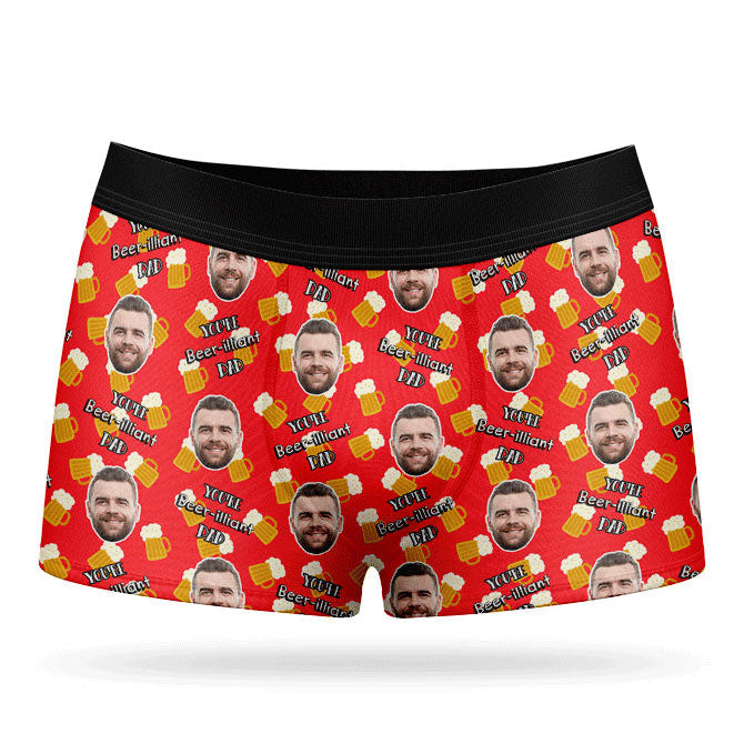 A pair of red custom boxers with a pattern of a man's face and beer bottles.