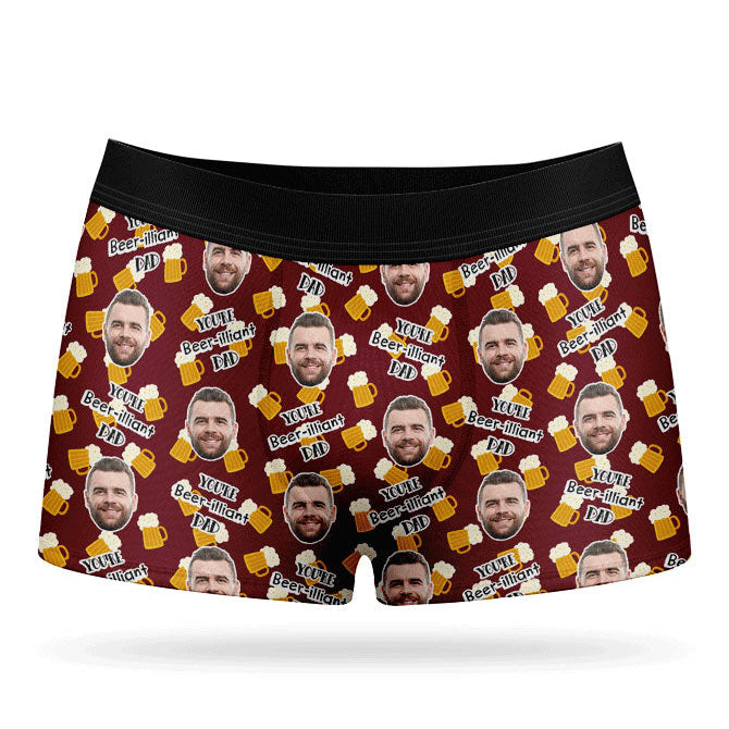 A pair of red custom boxers with a pattern of a man's face and beer bottles.