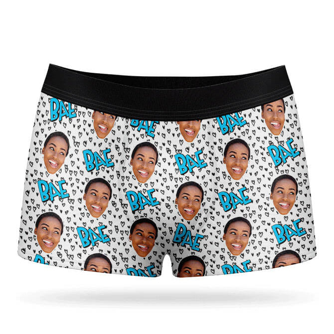A pair of white boxer shorts with a custom print of a person's face and the text 'BAE' repeated across the fabric.