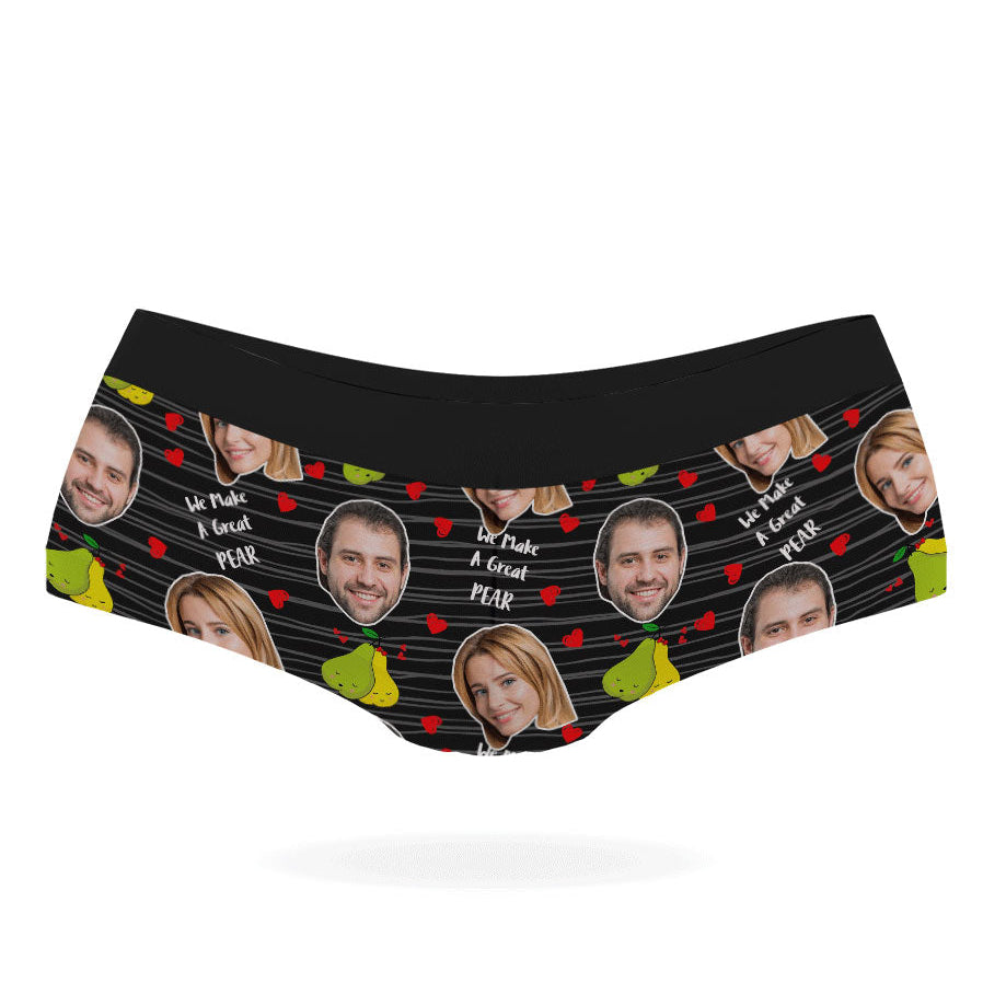 A pair of pink personalized panties with multiple faces printed on them, featuring a black elastic waistband.