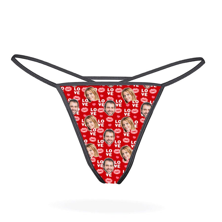This image displays the "Love Lips Custom Thong," a playful and customizable piece of lingerie. The thong features a vibrant purple design covered with a repeated pattern of the phrase "I love you" in a stylized font, accompanied by lips and hearts motifs.