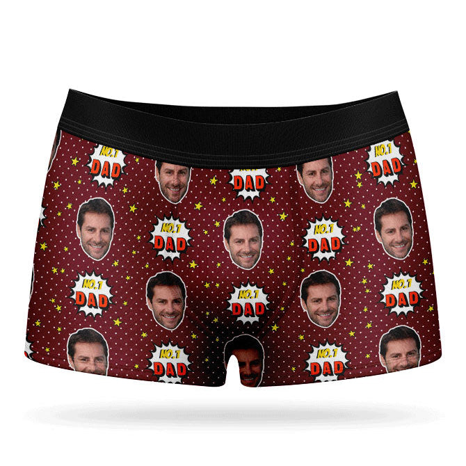 A pair of purple custom boxer briefs with a repeated pattern of a man's face and the text 'NUMBER 1 DAD'.