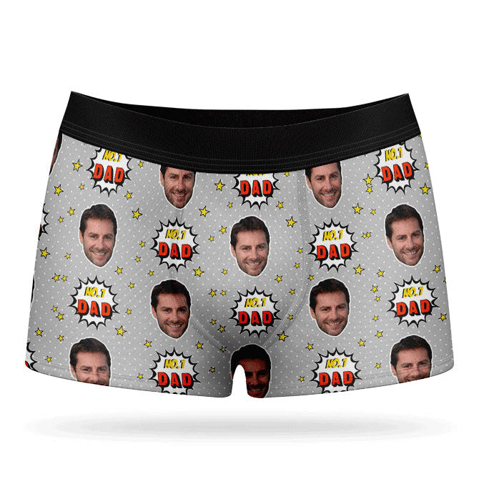 A pair of purple custom boxer briefs with a repeated pattern of a man's face and the text 'NUMBER 1 DAD'.