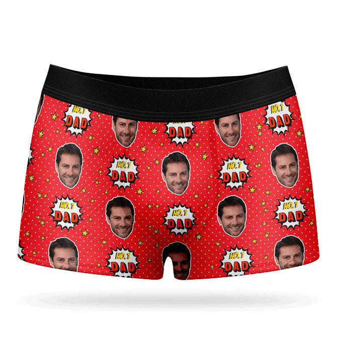 A pair of purple custom boxer briefs with a repeated pattern of a man's face and the text 'NUMBER 1 DAD'.