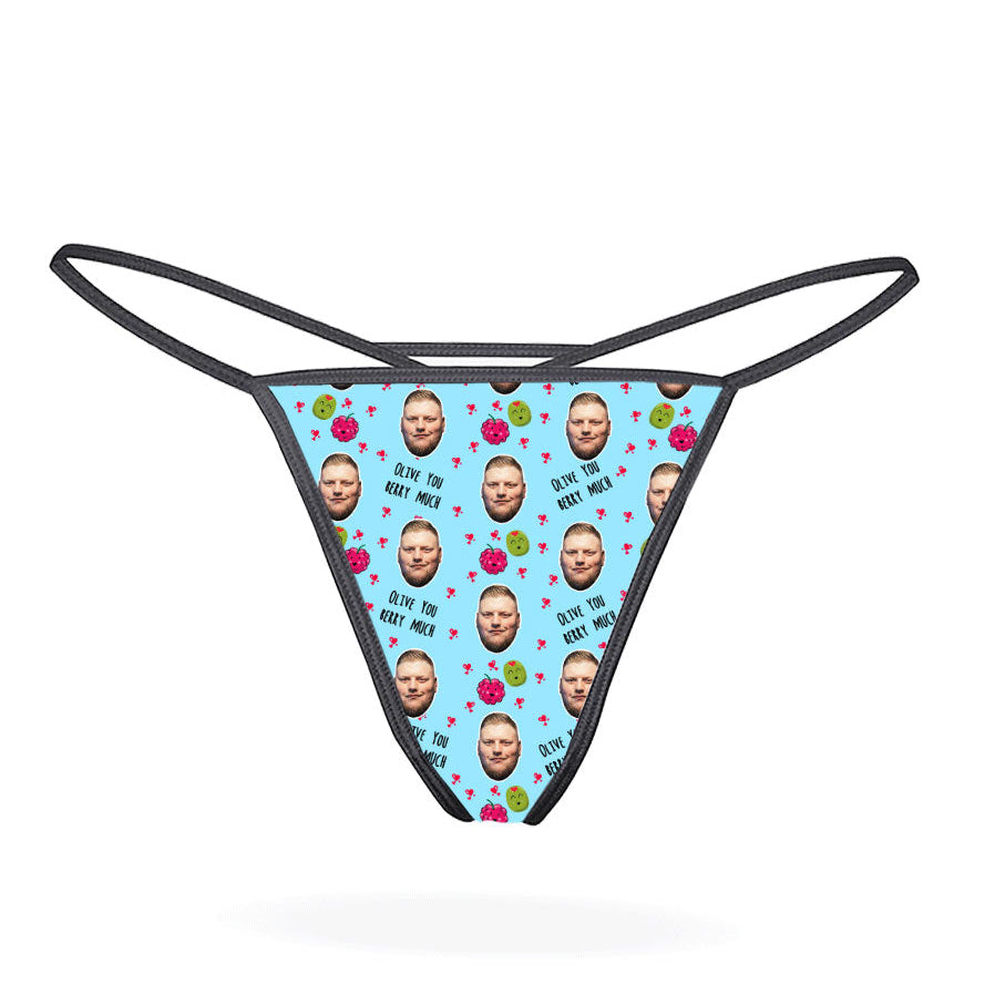 A pink thong with a pattern of cartoon characters displayed on the front.