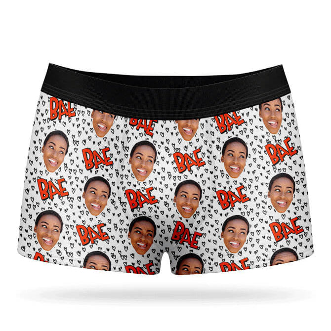 A pair of white boxer shorts with a custom print of a person's face and the text 'BAE' repeated across the fabric.