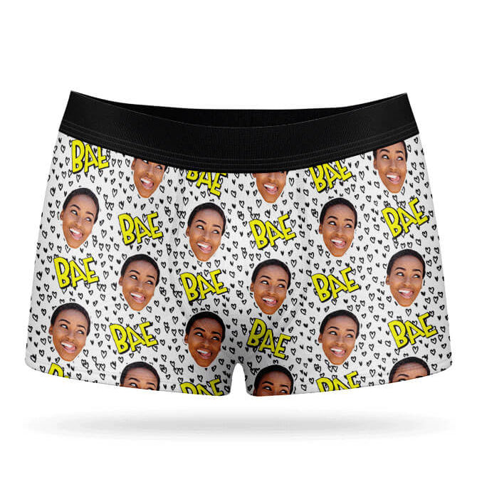 A pair of white boxer shorts with a custom print of a person's face and the text 'BAE' repeated across the fabric.