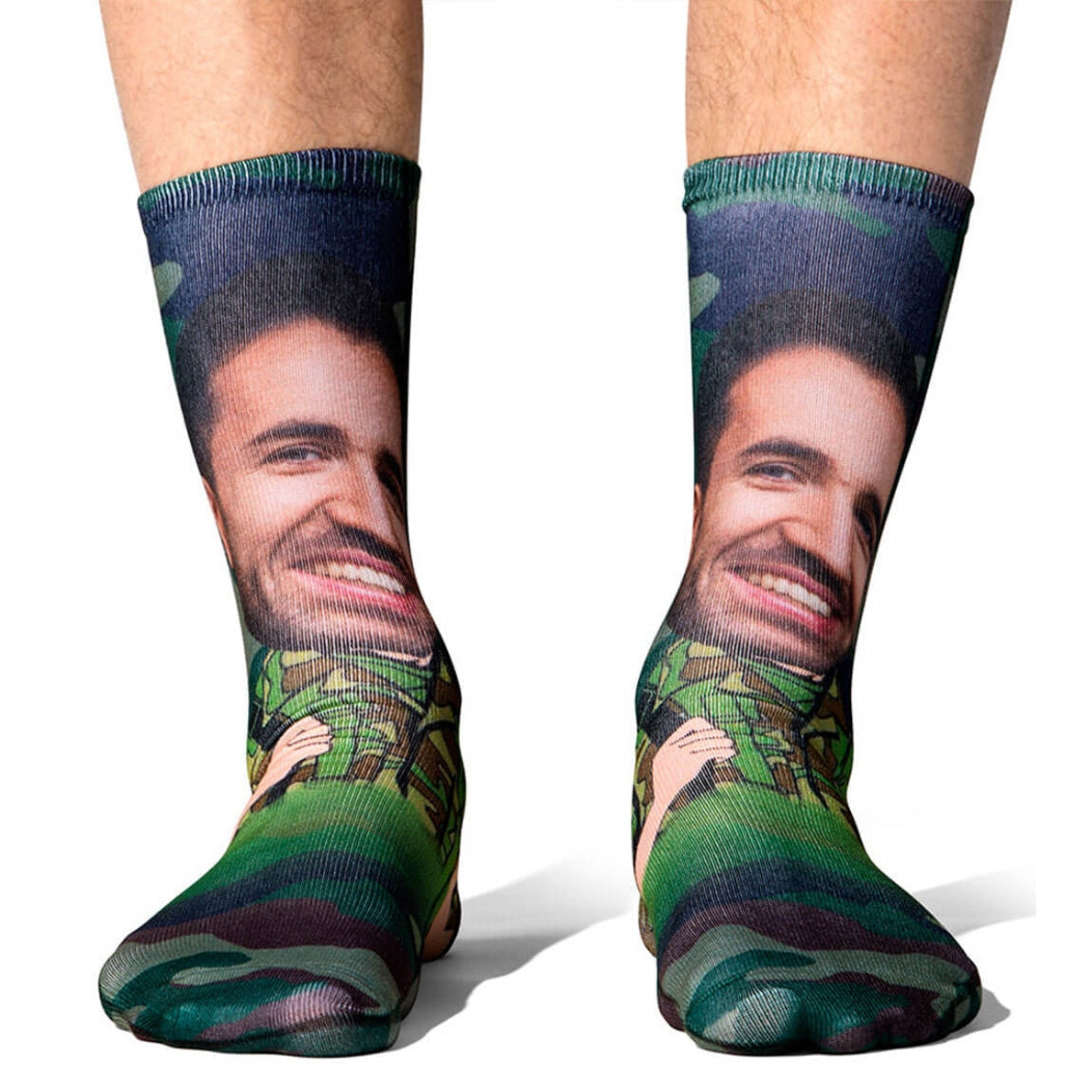 Colorful socks with a graphic design of a smiling face on a white background