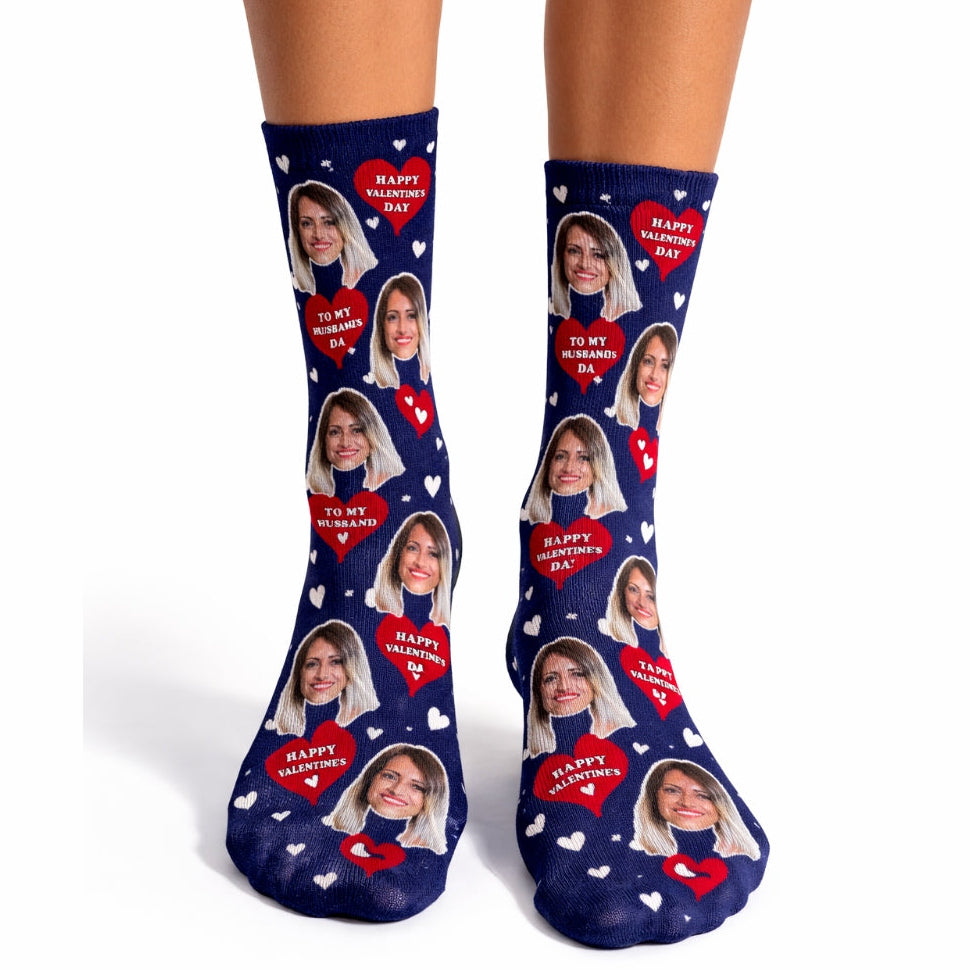 Navy blue socks with personalized face prints and 'Happy Valentine's Day' text on a white background.