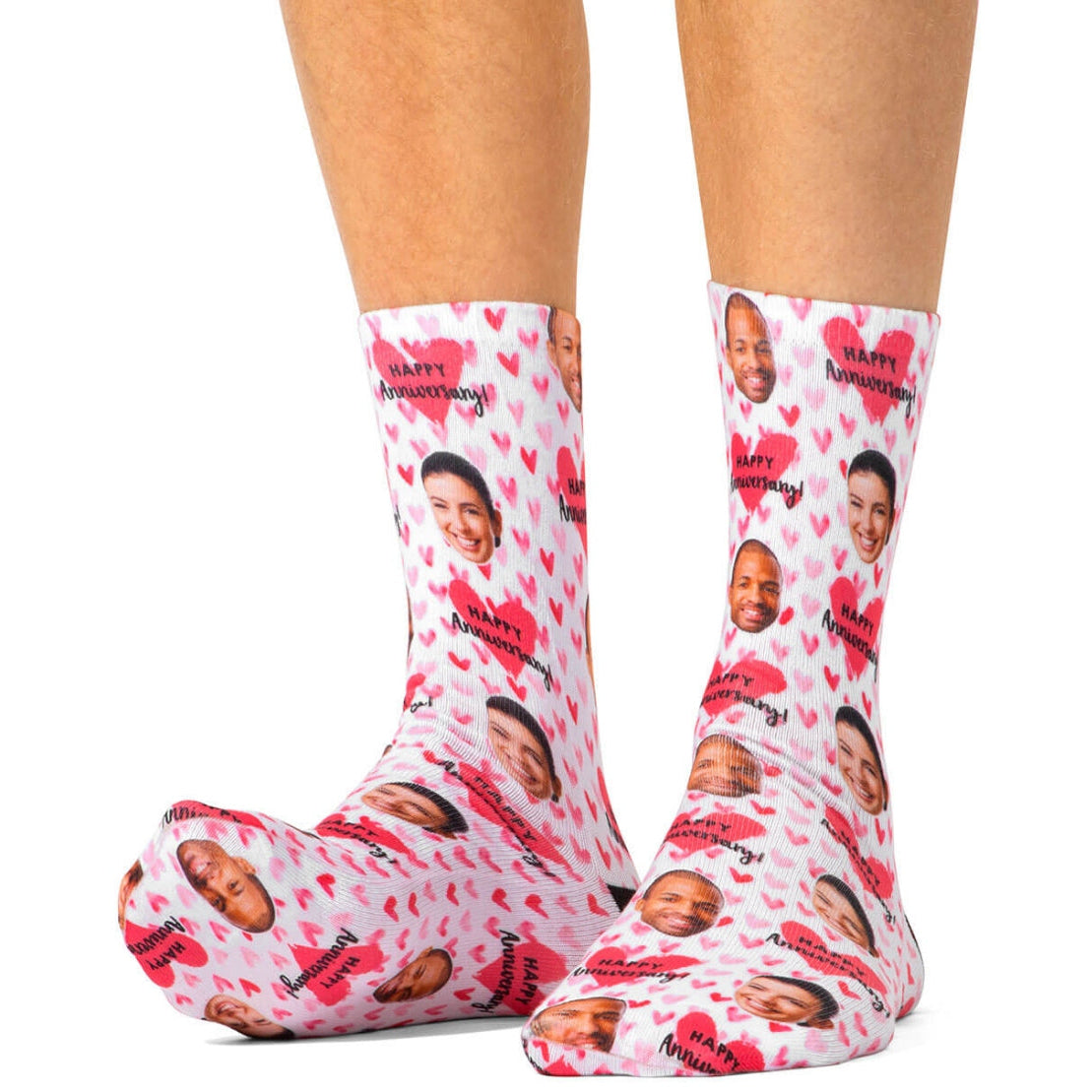 Socks with printed faces and 'Happy Anniversary!' text on a white background