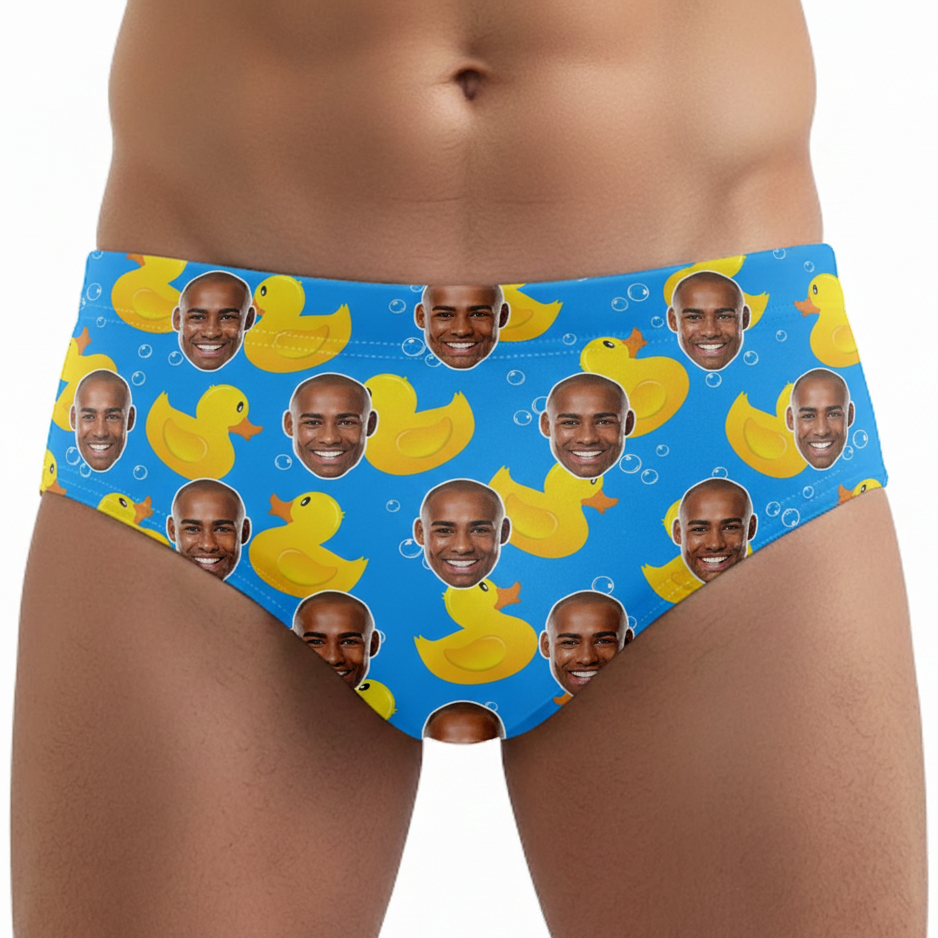 Blue underwear with yellow rubber ducks and faces on a white background