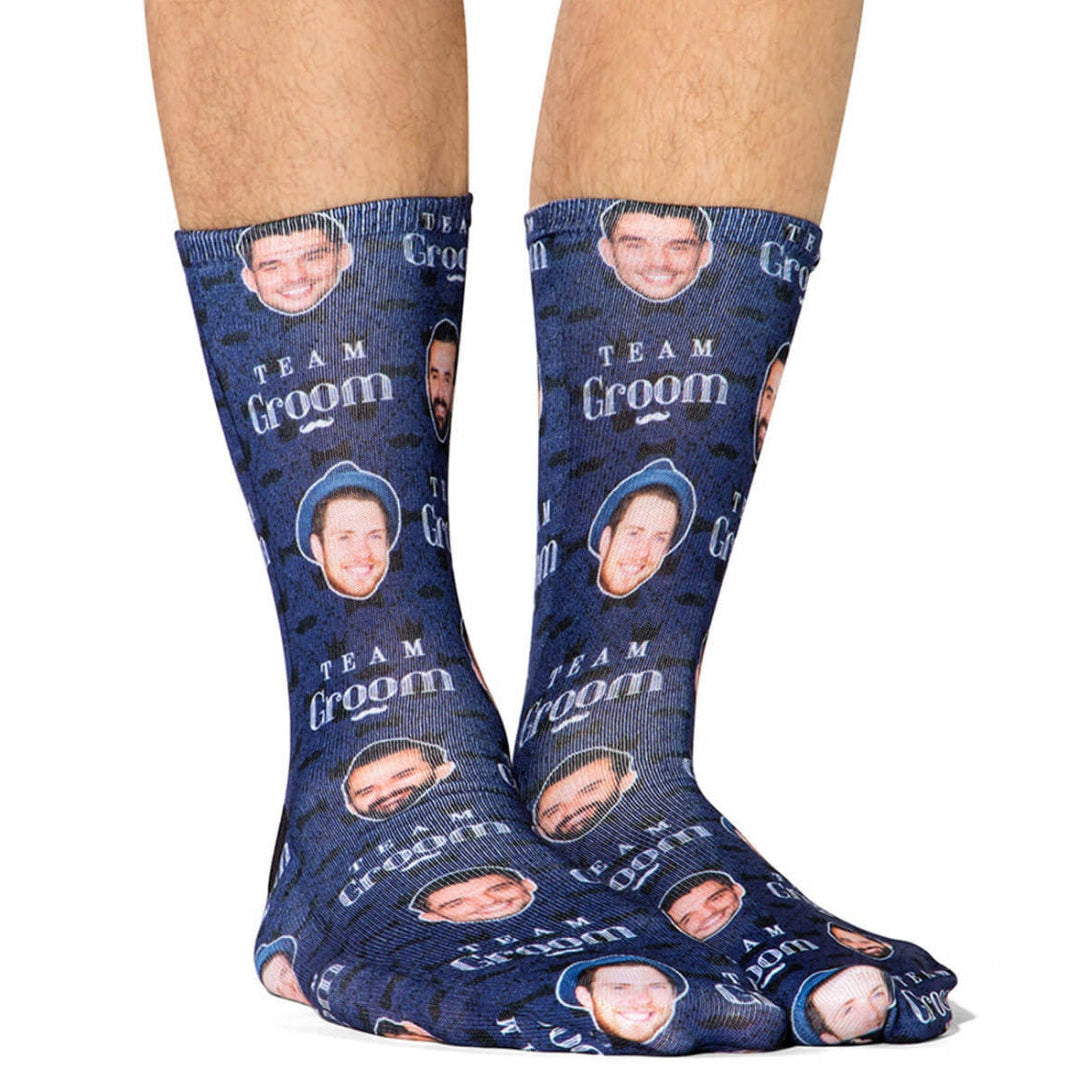 Blue socks with 'Team Groom' text and small images of a man on a white background