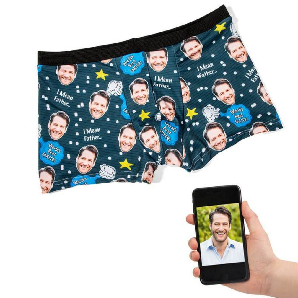 Personalized underwear with printed faces and a hand holding a phone displaying a photo.